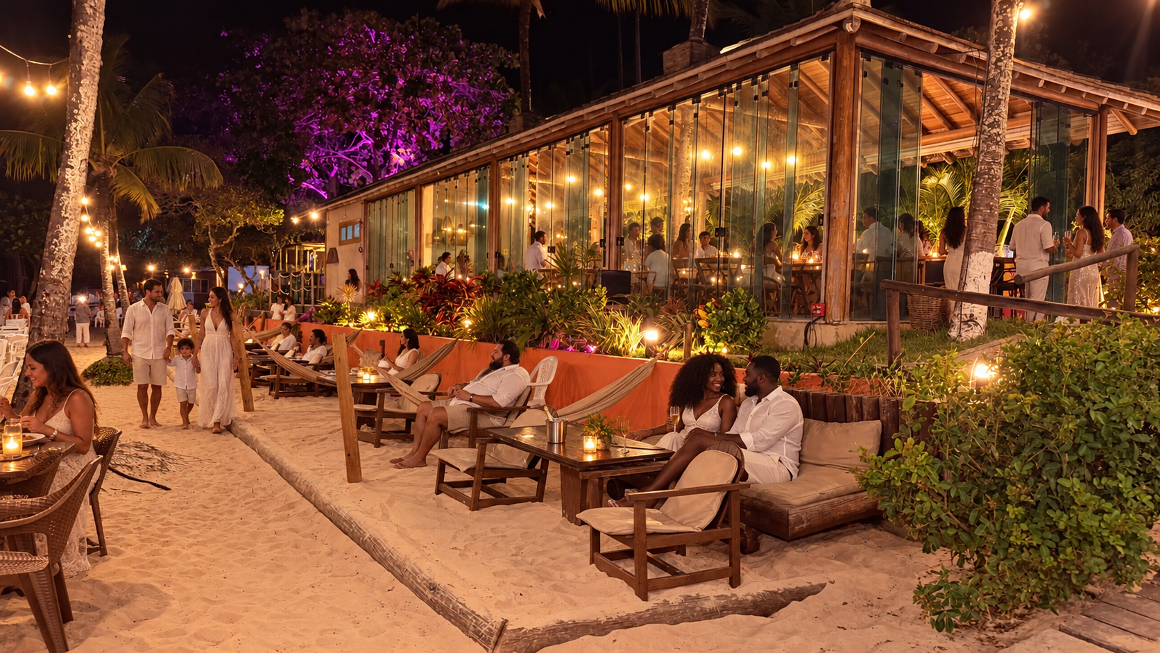 Lounge na areia com sofás, poltronas e mesa baixa